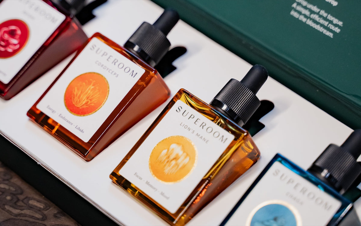 The four Superoom formulas in their Art of the Drop gift box